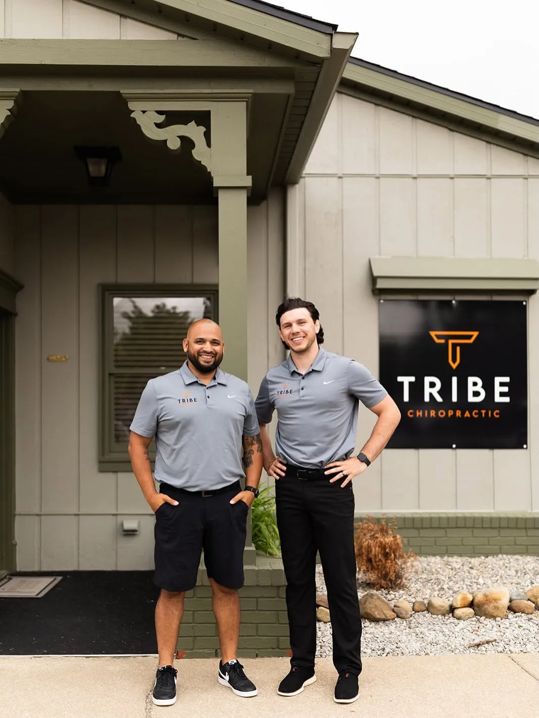 Dr. Devan Marry and Dr. Shane Wallace outside Tribe Chiropractic on North Evans Street
